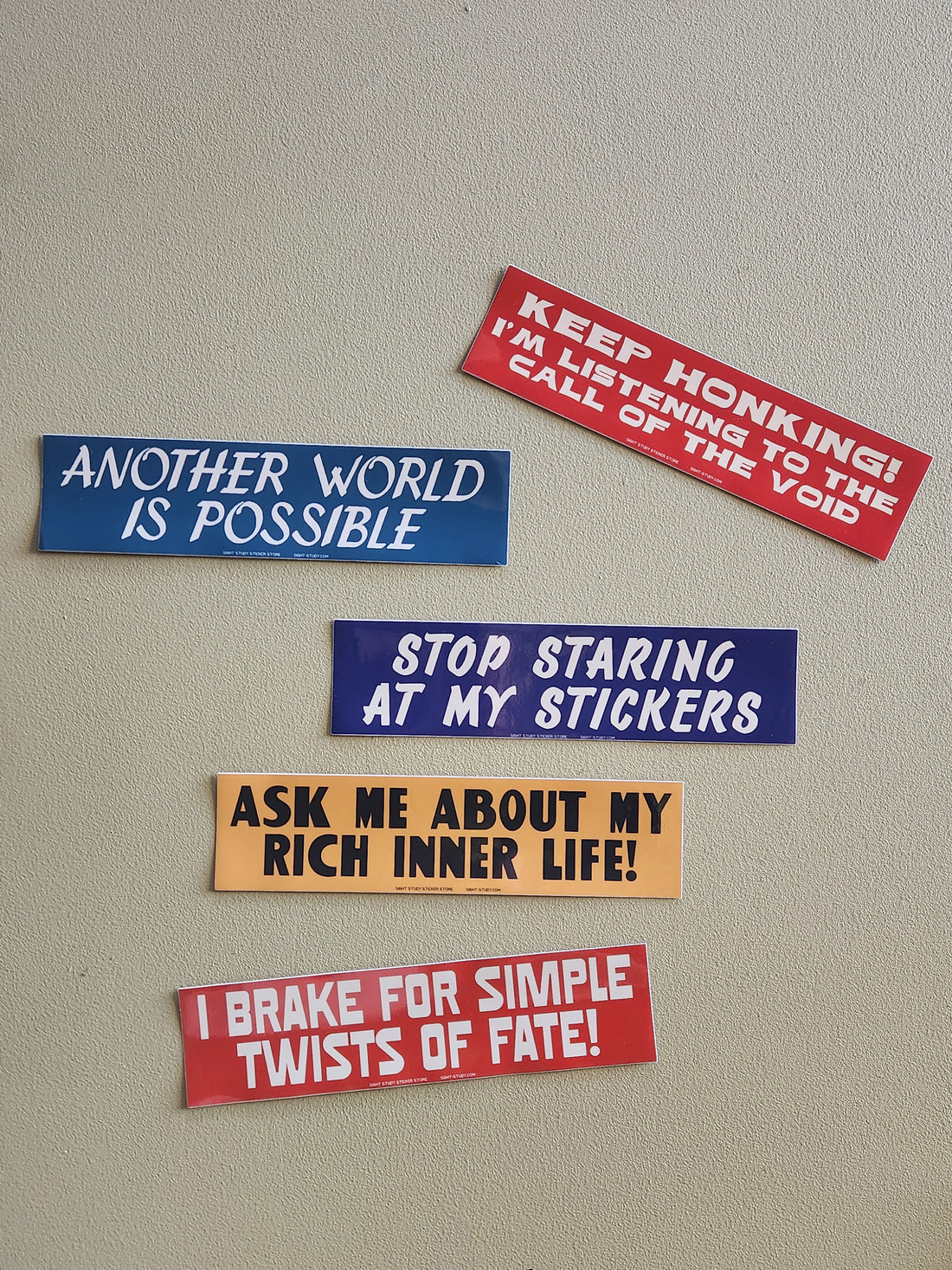 Set of humorous bumper stickers on a plain background
