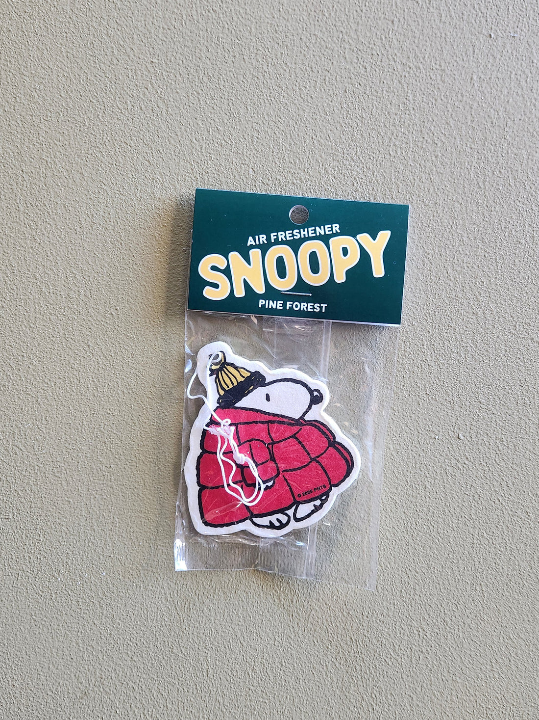 Snoopy-themed air freshener packaging on a plain background