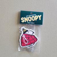 Snoopy-themed air freshener packaging on a plain background