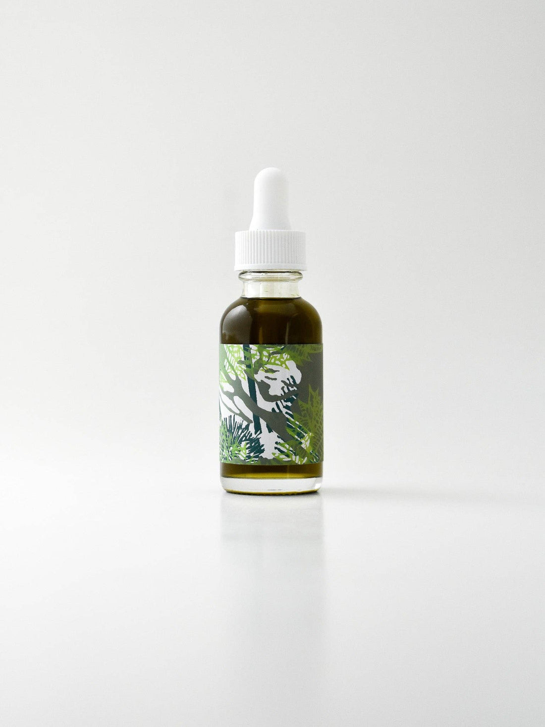 Bottle with dropper on a white background