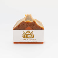 Bar of soap with 'Larrea' branding on a white background