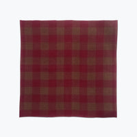 Deep wine and brown checkered fabric on a white background
