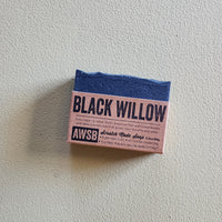 Small rectangular bar of soap with 'Black Willow' branding on a light gray background