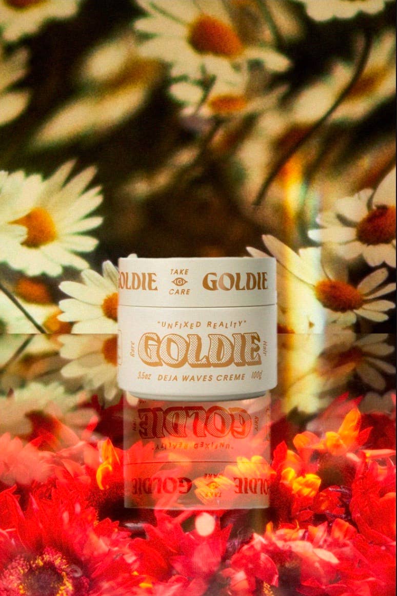 Goldie hair care product with floral background