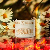 Goldie hair care product with floral background