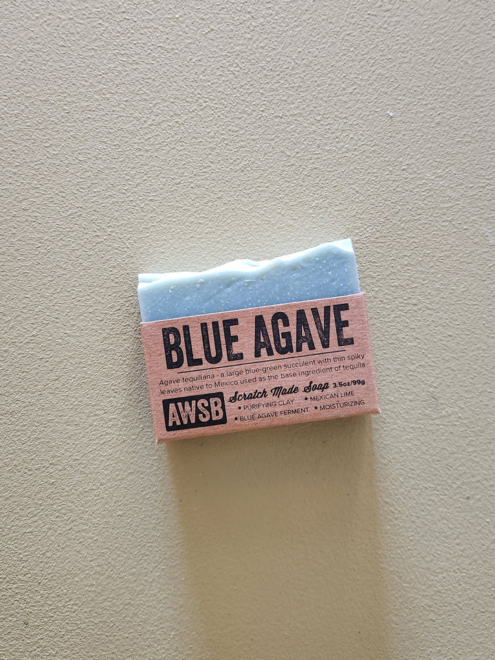 Bar of soap with 'Blue Agave' and 'AWSB' branding on a light gray background