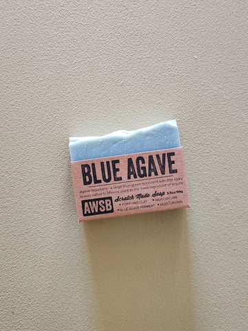 Bar of soap with 'Blue Agave' and 'AWSB' branding on a light gray background