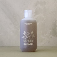 Bottle labeled 'Desert Cedar' on a neutral background