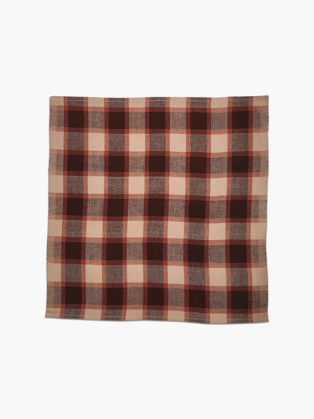 Plaid fabric with brown and beige pattern on a white background