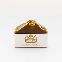 Bar of soap with 'Larrea' branding on a white background