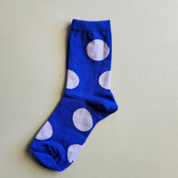 Cobalt blue women's cotton socks with pale blue polka dots all over.