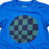 Blue t-shirt with a green and navy checkered circle design on a white background