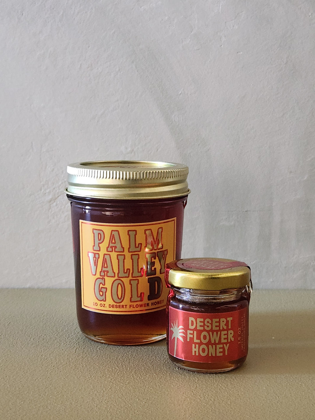 Two jars of honey with &