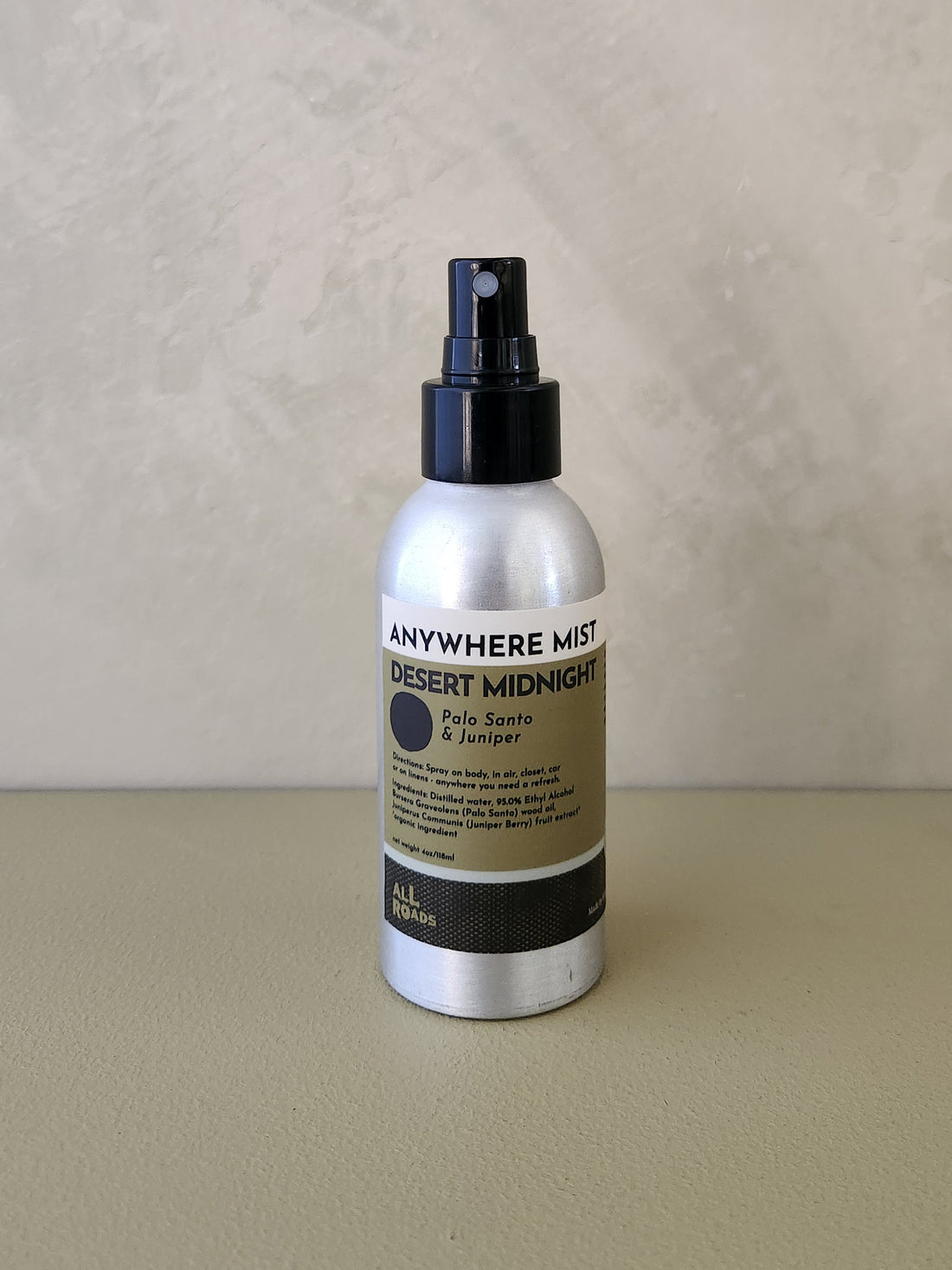 A silver spray bottle of &