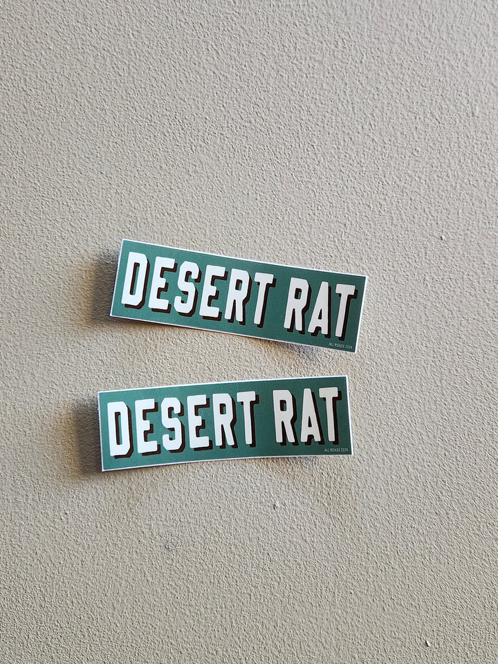 Two 'DESERT RAT' emblems on a gray background