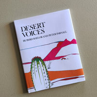 Book titled 'Desert Voices' by Hyrd Baylor and Peter Parnall on a beige background