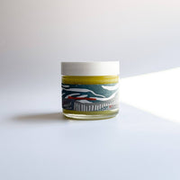 Small jar with a label on a white background