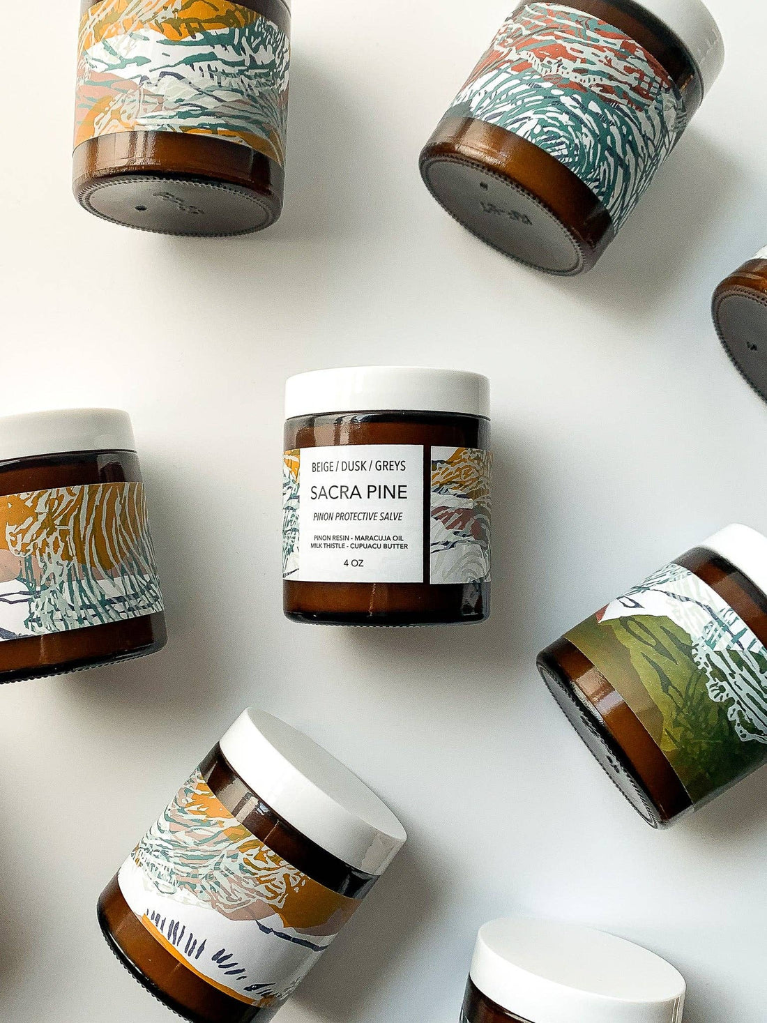 Jars with decorative labels on a white background