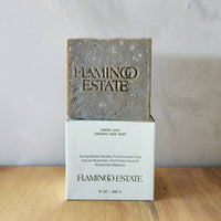 An oversized brick of handmade soap made from herbs and plants. 