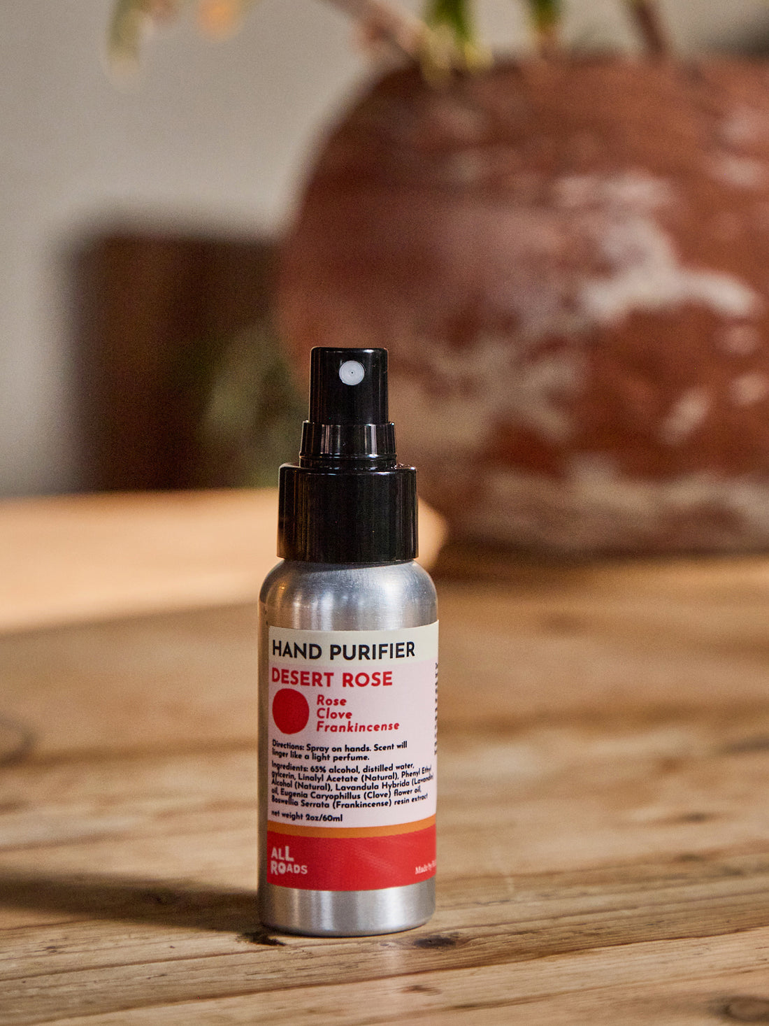 A small hand sanitizer bottle labeled &