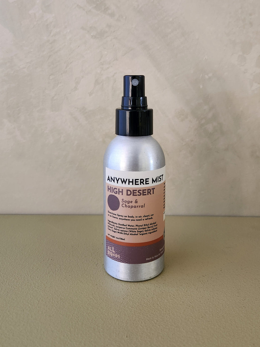 A silver spray bottle of &