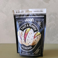 Packaging of Joon Salt & Pepper Pistachios on a neutral background