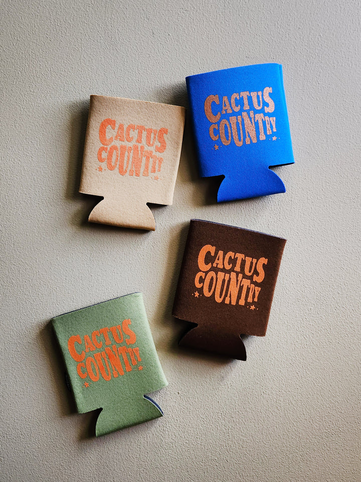 beverage koozie with the words cactus country.
