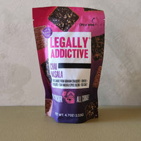 Bag of Legally Addictive Chai Masala crackers on a neutral background