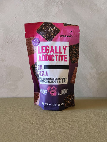 Bag of Legally Addictive Chai Masala crackers on a neutral background