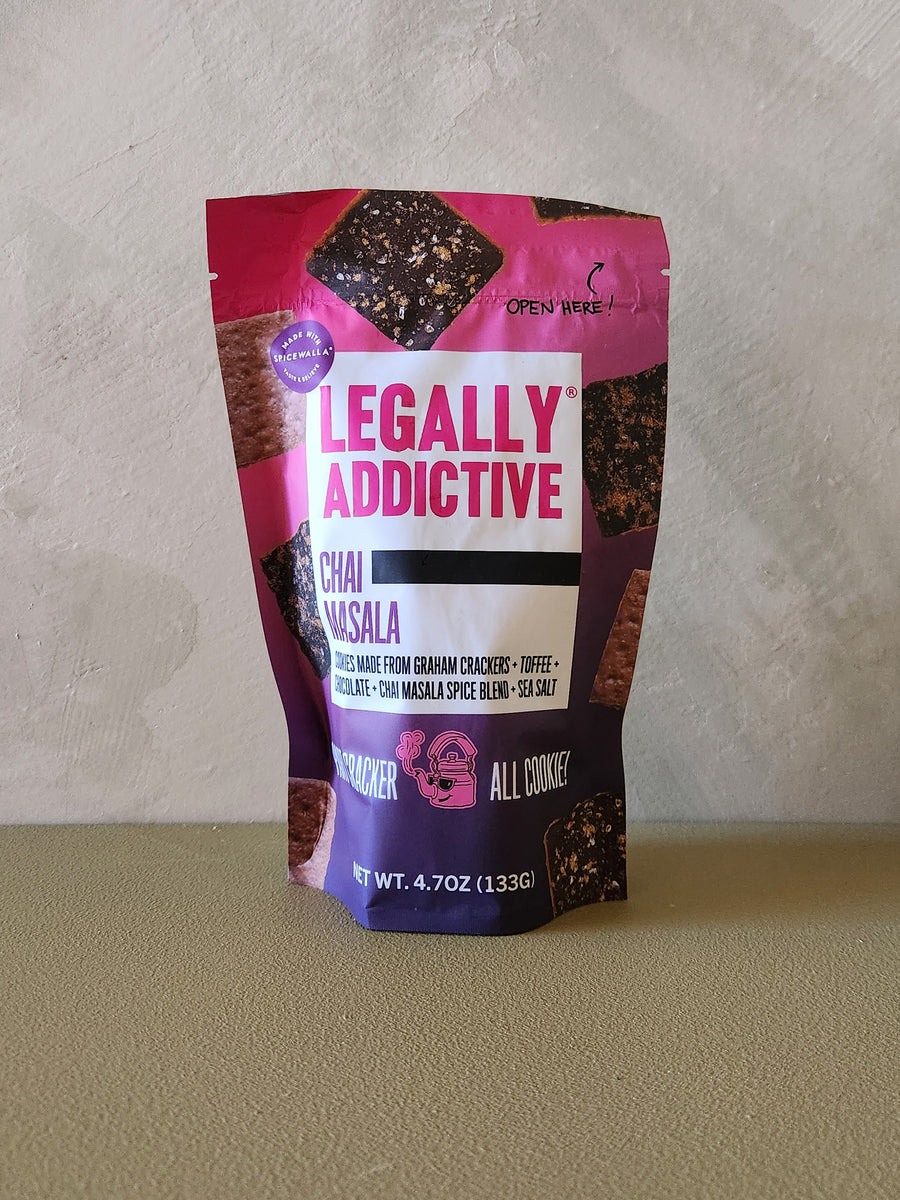 Bag of Legally Addictive Chai Masala crackers on a neutral background
