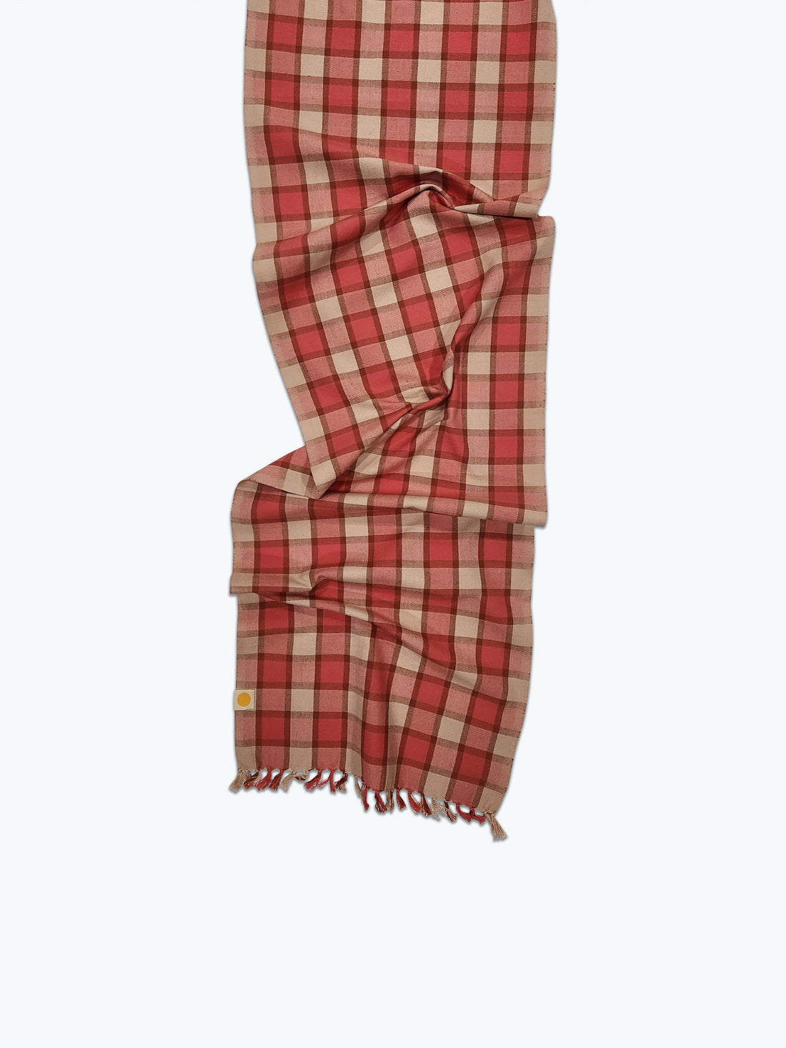 Red and beige checkered scarf on a white background