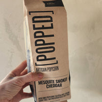 a bag of popcorn with mesquite smoked cheddar seasoning