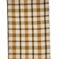 A folded plaid fabric item, likely a blanket or throw, featuring a warm autumn pattern of brown, beige, sage green, and thin black stripes on a white background.