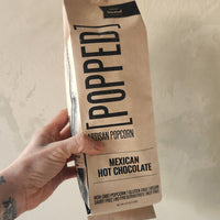 a bag of popcorn flavored like mexican hot chocolate.