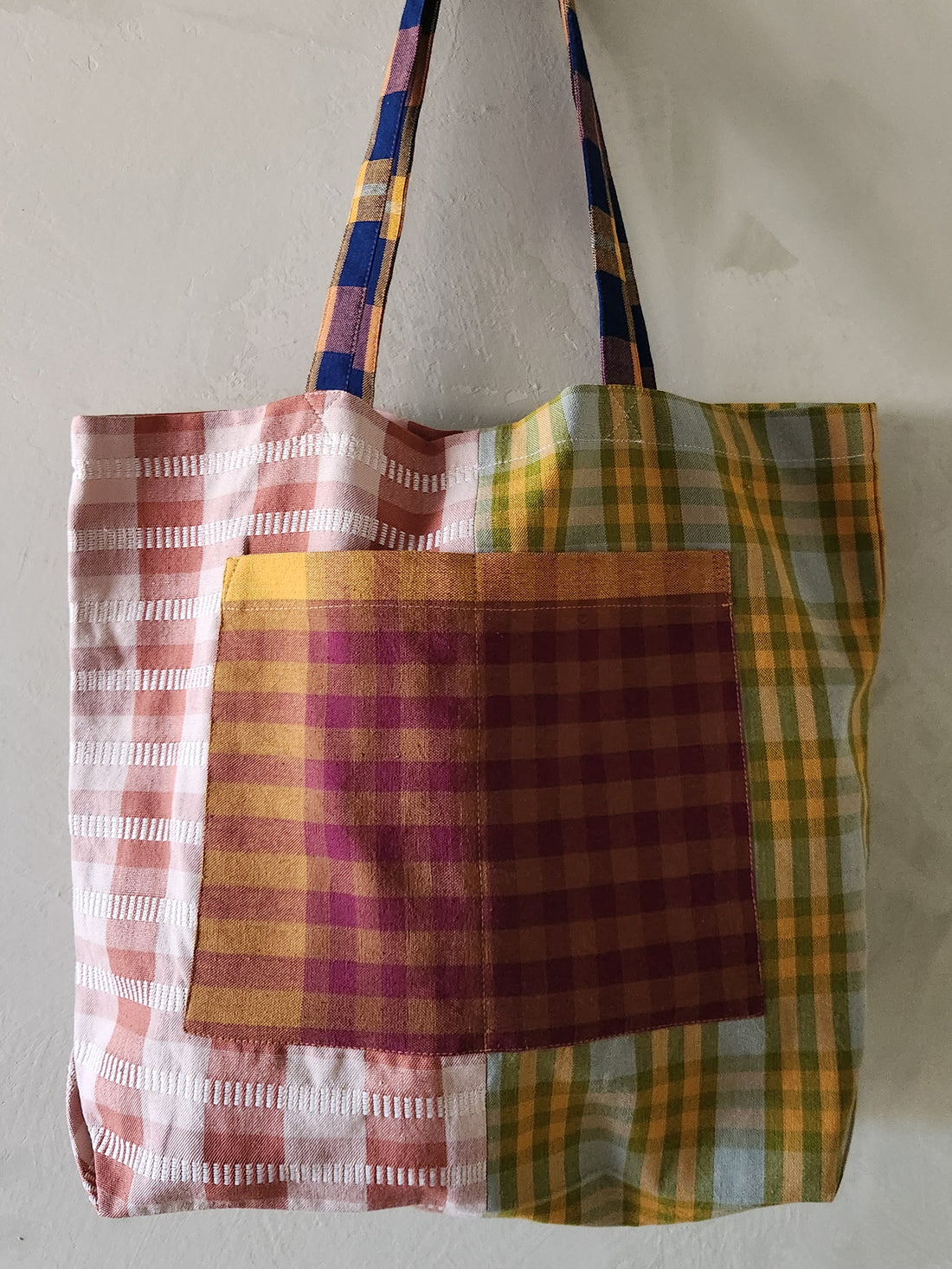 Plaid patterned tote bag on a plain background