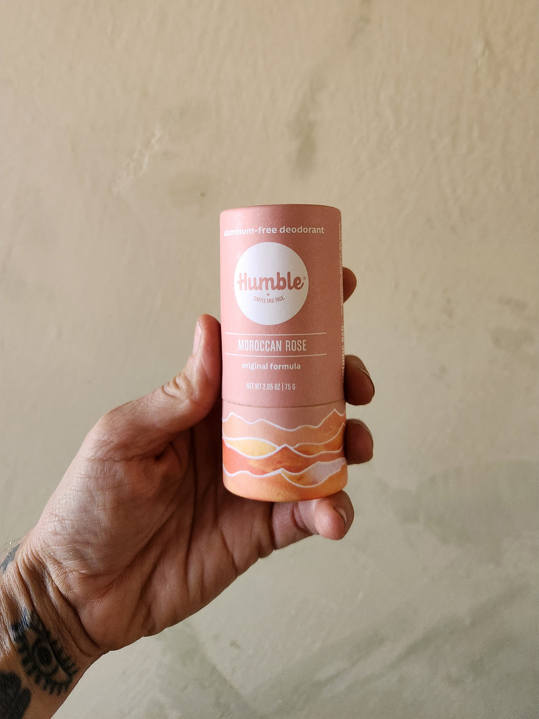 Hand holding a pink &