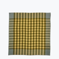 Plaid napkin in shades of green.