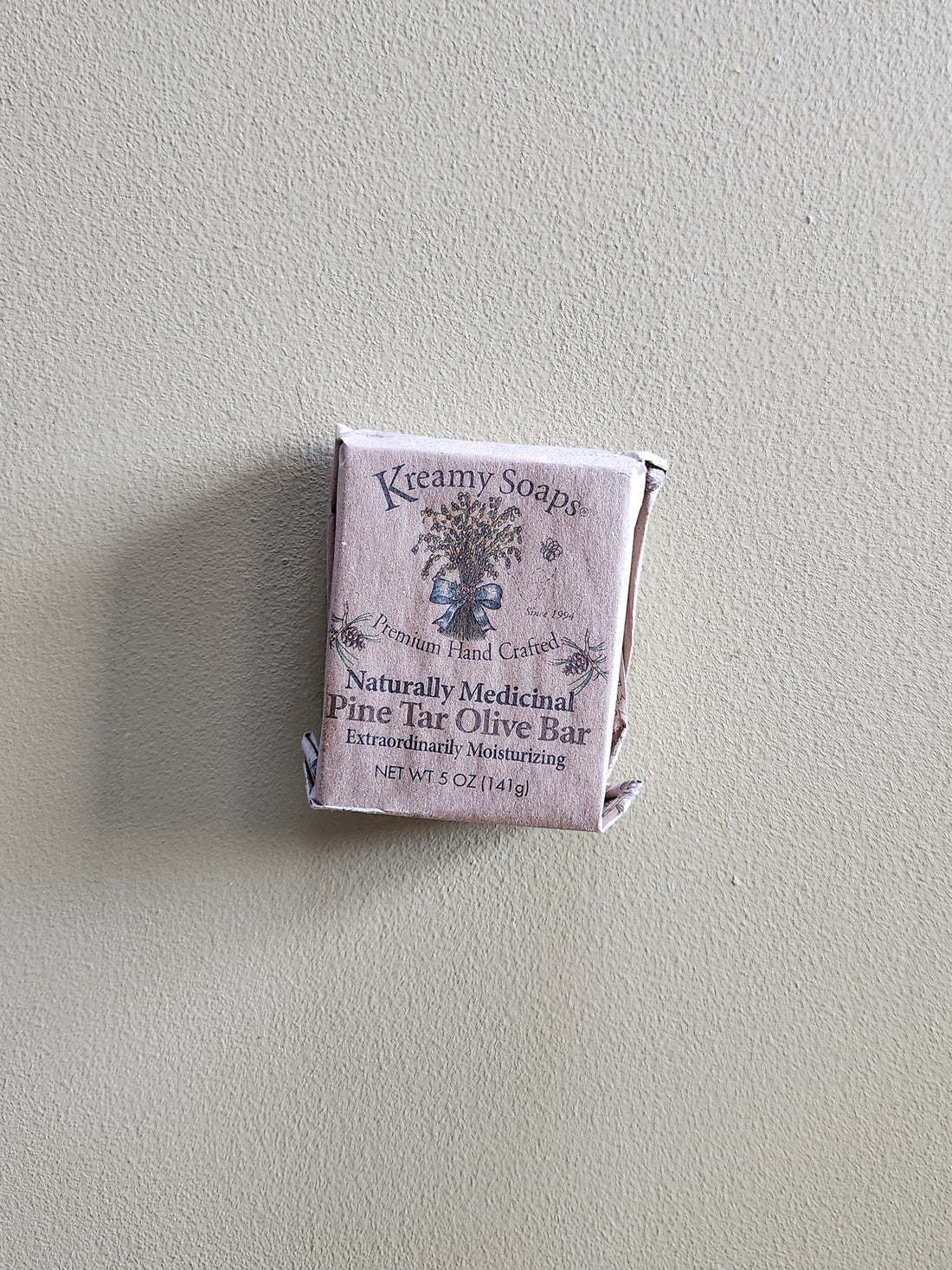 K creamy soap bar packaging on a light gray background