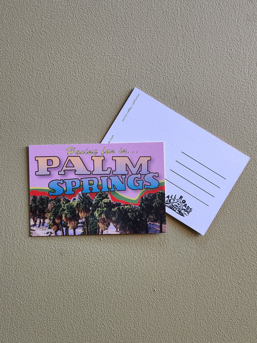Postcard with 'Palm Springs' design on a gray surface