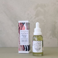 Bottle and box of Velvet Antler Studio Bruges Prickly Pear skincare product on a neutral background