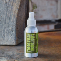 Bottle of Rabbitbrush Hyrdosol on a stone surface with a blurred natural background