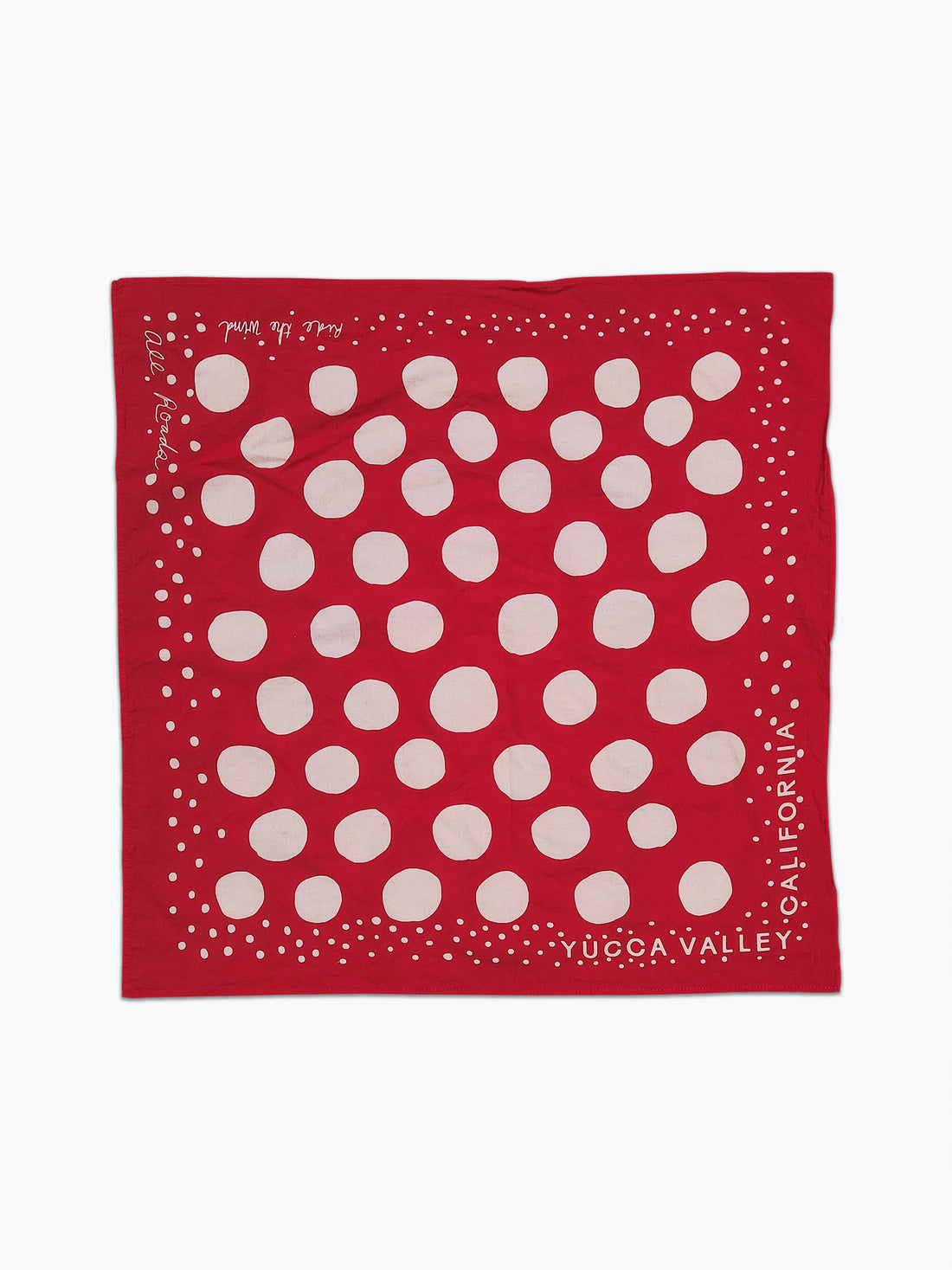 Red bandana with white circles