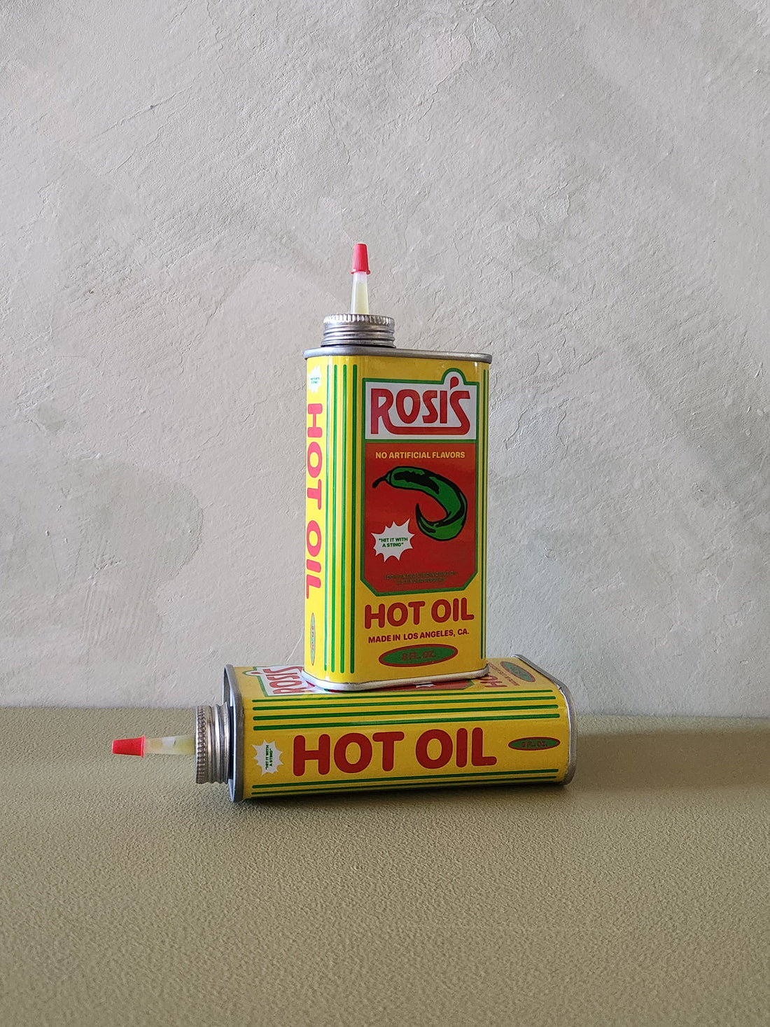 A metal can that says Rosi&