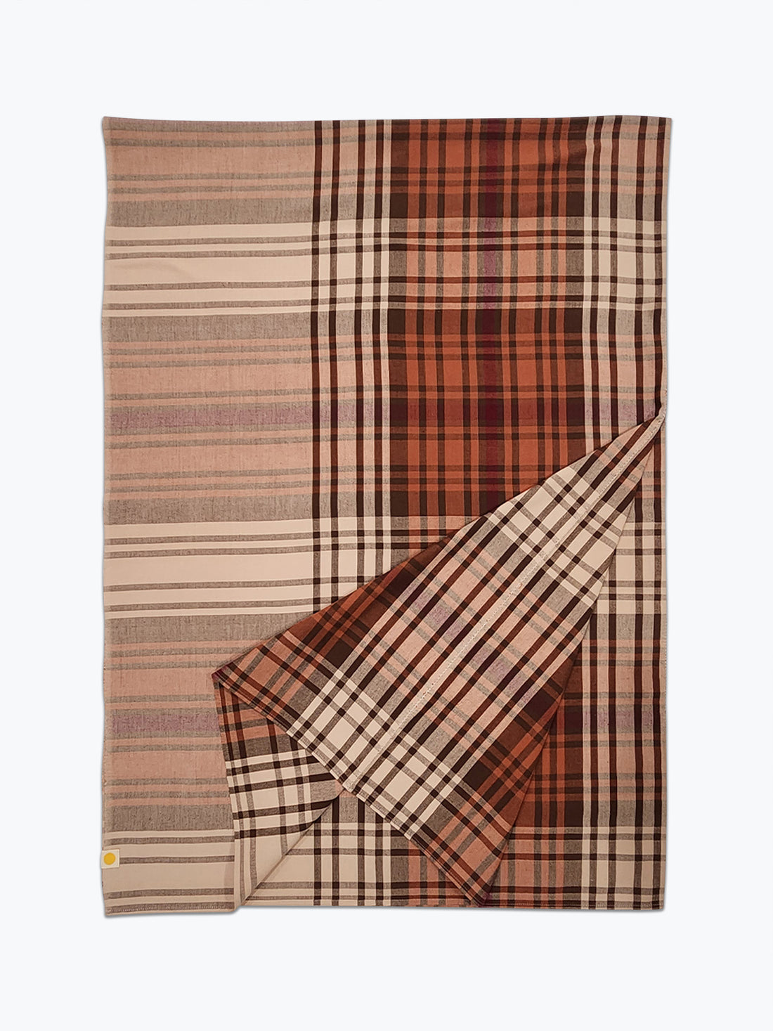 Plaid blanket with brown and beige colors on a white background