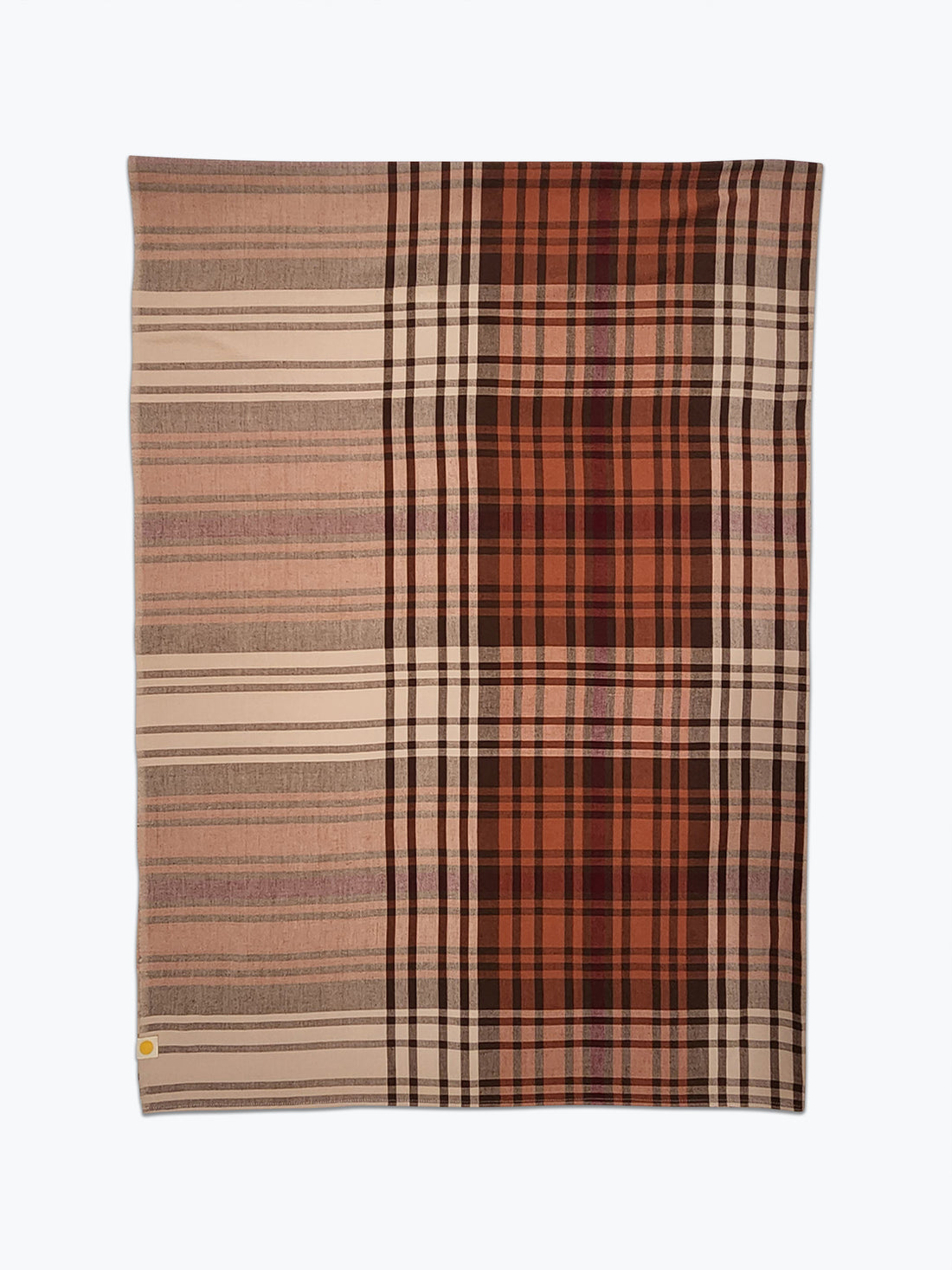 Plaid blanket with brown, beige, and red colors on a white background