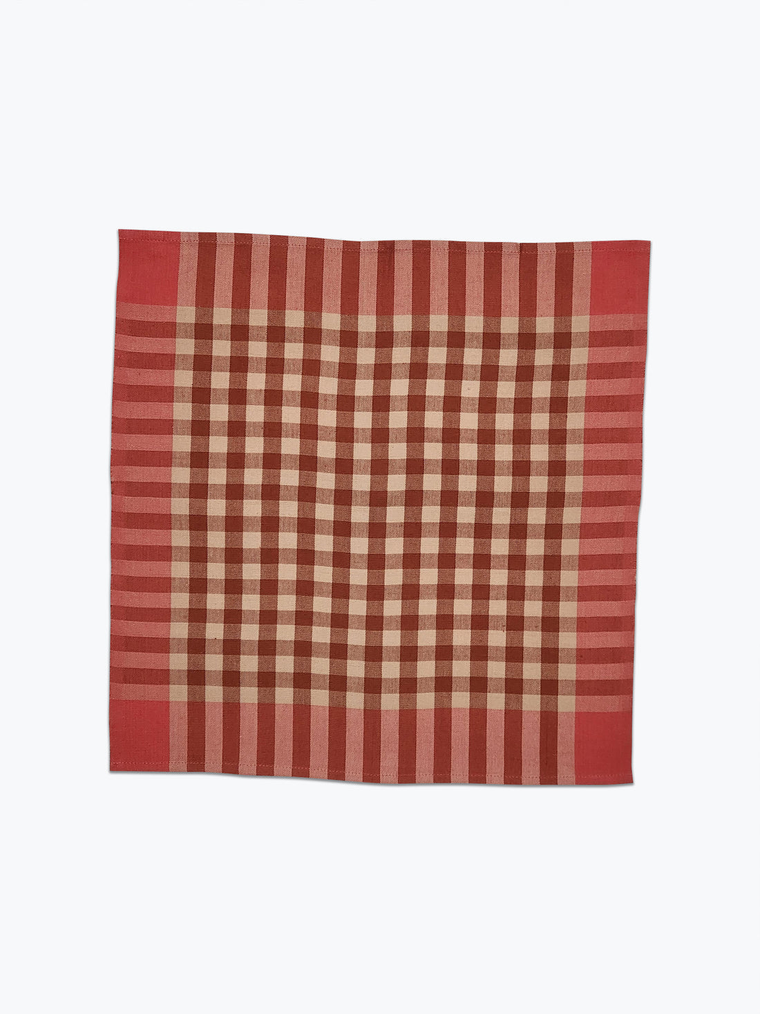 Pink and beige checkered fabric on a white background