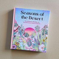 Book titled 'Seasons of the Desert' on a beige background