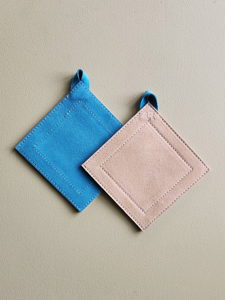 Teal and tan suede leather square potholder. 