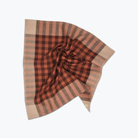 Plaid headscarf with a knot on a white background