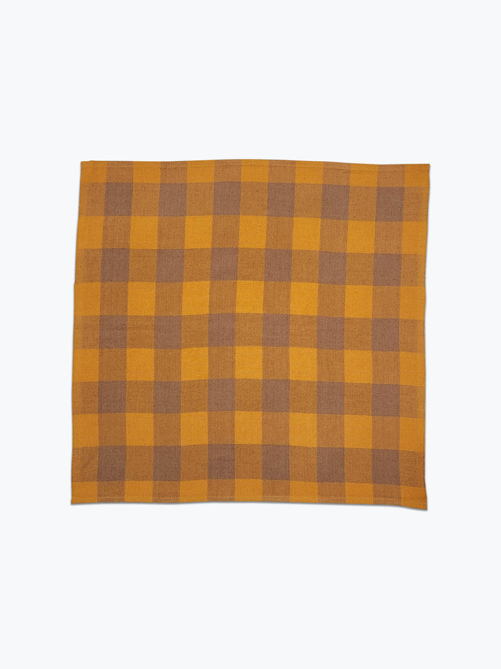 Large scale gingham plaid in ochre yellow and tan.